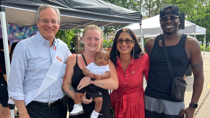 Aron, Alexis, baby Bishop, Mona, and Jermaine enjoy the Flint Rx Kids Baby Parade.
